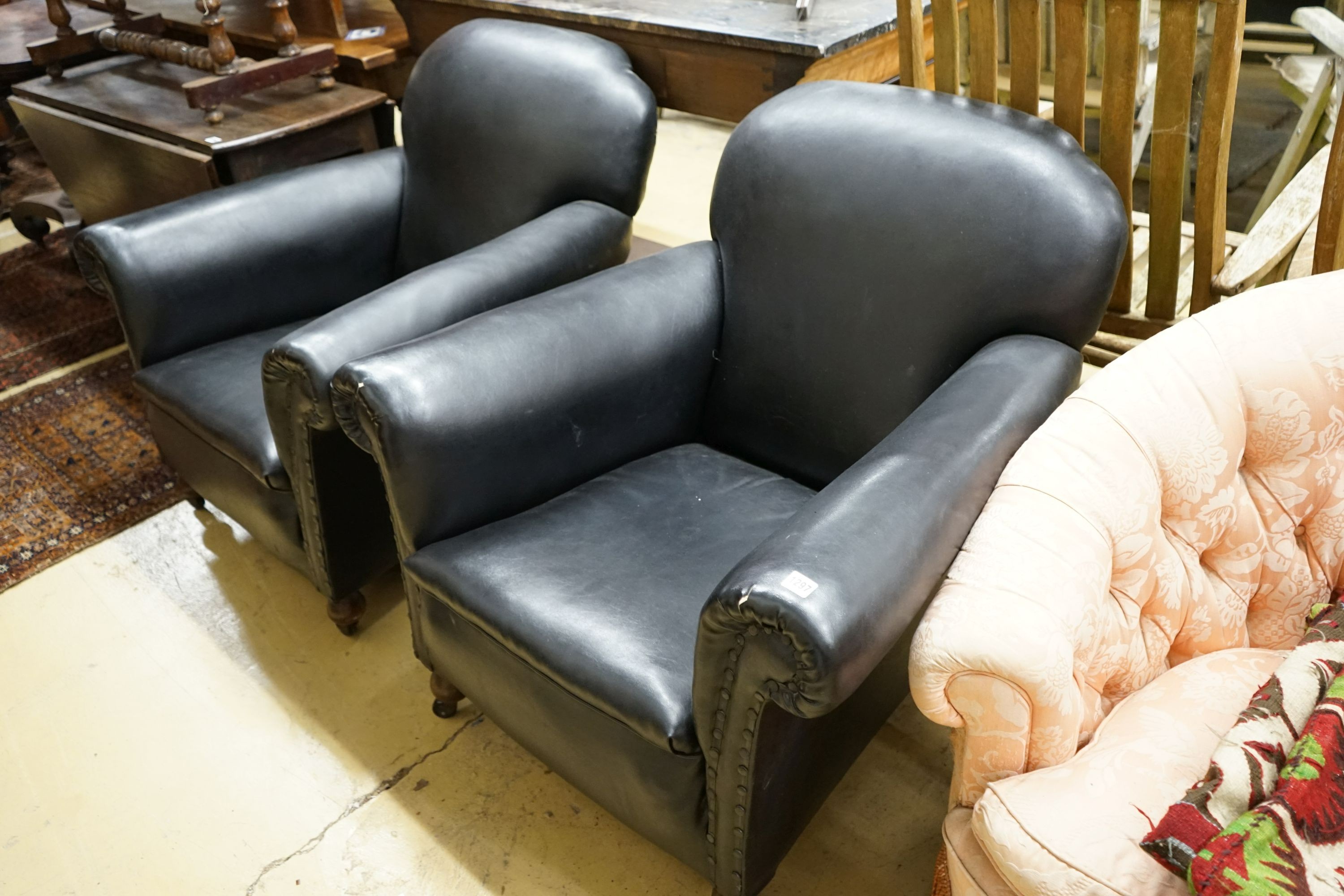 A pair of early 20th century club armchairs, width 88cm, depth 88cm, height 84cm